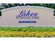 An attractive sign surrounded by meticulously maintained landscaping welcomes you to Lakes of Mount Dora active adult community at 8167 Bridgeport Bay Cir, Mount Dora, FL 32757