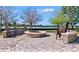 The outdoor firepit area has seating for all and is perfect for socializing while taking in the view of the lake at 8167 Bridgeport Bay Cir, Mount Dora, FL 32757