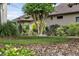Well-maintained front yard with mature trees and Sandhill Cranes enjoying the peaceful outdoor space at 8167 Bridgeport Bay Cir, Mount Dora, FL 32757