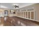Inviting living area with wood floors and decorative wall paneling, perfect for entertaining guests at 8167 Bridgeport Bay Cir, Mount Dora, FL 32757