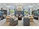 This lounge features elegant furnishings and a tranquil setting, creating the perfect space to relax and read at 8167 Bridgeport Bay Cir, Mount Dora, FL 32757