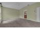 Cozy carpeted bedroom offering access to the bathroom and additional storage space at 8167 Bridgeport Bay Cir, Mount Dora, FL 32757