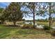 Serene pond view showcasing the tranquil water and surrounding trees at 8167 Bridgeport Bay Cir, Mount Dora, FL 32757