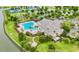 Aerial view of the community pool, along with tennis courts and a recreational area at 8167 Bridgeport Bay Cir, Mount Dora, FL 32757