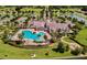 Aerial view of the community pool, a lagoon style pool featuring several areas for different activities at 8167 Bridgeport Bay Cir, Mount Dora, FL 32757