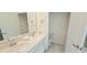 Bright bathroom with double sinks, stylish faucets, and a clean, modern design at 817 Ocean Course Ave # 502, Davenport, FL 33896