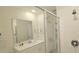Well-lit bathroom with a single sink, modern shower, and sleek fixtures at 817 Ocean Course Ave # 502, Davenport, FL 33896