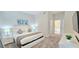 Comfortable bedroom featuring a bed, nightstands, and carpeted floors at 817 Ocean Course Ave # 502, Davenport, FL 33896