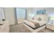 Bright bedroom featuring a comfortable bed, carpeted floors, and modern decor at 817 Ocean Course Ave # 502, Davenport, FL 33896