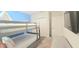 Cozy bedroom featuring a bunk bed, neutral carpet, and entertainment center at 817 Ocean Course Ave # 502, Davenport, FL 33896