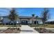 Well-maintained community center with landscaped grounds, sidewalk, and street front parking at 817 Ocean Course Ave # 502, Davenport, FL 33896