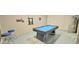 Spacious game room featuring a pool table, wall decor, and bar stools at 817 Ocean Course Ave # 502, Davenport, FL 33896