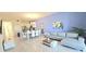 Spacious living area featuring tile flooring and an open floor plan with a kitchen and dining area at 817 Ocean Course Ave # 502, Davenport, FL 33896
