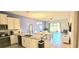 Open-concept living space with modern kitchen, dining area, and comfortable seating at 817 Ocean Course Ave # 502, Davenport, FL 33896