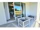 Comfortable outdoor seating on screened lanai with views to interior of home and golf course at 817 Ocean Course Ave # 502, Davenport, FL 33896