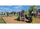 Fun community playground featuring modern play equipment with slides, climbers, and swings at 817 Ocean Course Ave # 502, Davenport, FL 33896