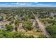 Birds-eye view of homes in a residential area with tree-lined streets at 8410 Lake Bosse Dr, Orlando, FL 32810