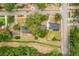 An aerial view of the neighborhood and homes including their yards at 8410 Lake Bosse Dr, Orlando, FL 32810