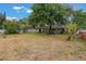 Large backyard with mature trees, and plenty of space to roam at 8410 Lake Bosse Dr, Orlando, FL 32810