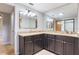 Bathroom with double sink vanity, granite countertops, modern fixtures, and plenty of storage at 8410 Lake Bosse Dr, Orlando, FL 32810