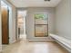 Additional room with a window and bench seating next to a bathroom at 8410 Lake Bosse Dr, Orlando, FL 32810