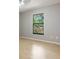 Cozy bedroom with a large window offering scenic backyard views and filling the room with light at 8410 Lake Bosse Dr, Orlando, FL 32810
