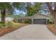 Charming single story home featuring an attached two car garage, and a spacious front yard with mature landscaping at 8410 Lake Bosse Dr, Orlando, FL 32810