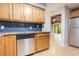 Well-lit kitchen features stainless steel appliances, ample cabinet space, and a modern backsplash at 8410 Lake Bosse Dr, Orlando, FL 32810