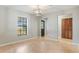 This inviting living area features natural light, access to other rooms, and light-toned flooring at 8410 Lake Bosse Dr, Orlando, FL 32810