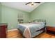 Bedroom features a full bed with nightstands and a large window allowing for natural light at 866 Ashworth Overlook Dr # B, Apopka, FL 32712