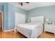 Bright primary bedroom features wood floors, a ceiling fan, and a large closet at 866 Ashworth Overlook Dr # B, Apopka, FL 32712