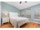 Primary bedroom featuring wood floors, vaulted ceilings, and plenty of natural light from two windows at 866 Ashworth Overlook Dr # B, Apopka, FL 32712