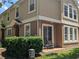 Exterior corner view of two-story townhome with patio at 866 Ashworth Overlook Dr # B, Apopka, FL 32712