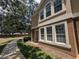 Exterior corner view of two-story townhome with walkway at 866 Ashworth Overlook Dr # B, Apopka, FL 32712