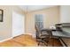 A home office is bright with hardwood floors, a neutral color scheme, and closet at 866 Ashworth Overlook Dr # B, Apopka, FL 32712