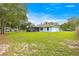 Large backyard featuring a shed and screened-in patio offering outdoor enjoyment and storage at 8869 Se 159Th Pl, Summerfield, FL 34491