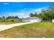 Well-maintained single-story home with a long driveway and two-car garage offering convenience and curb appeal at 8869 Se 159Th Pl, Summerfield, FL 34491