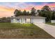 Charming single-story home with manicured lawn and welcoming two-car garage, perfect for suburban living at 8869 Se 159Th Pl, Summerfield, FL 34491