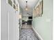Bright foyer featuring wood-look flooring, stylish decor, and open view to the living space at 8869 Se 159Th Pl, Summerfield, FL 34491