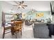 Open concept living room with kitchen and dining area at 8869 Se 159Th Pl, Summerfield, FL 34491