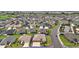 Aerial view of property showcasing golf course community and landscaping at 892 Hubbard Loop, The Villages, FL 32163