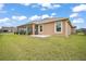 Exterior view showing backyard and screened lanai at 892 Hubbard Loop, The Villages, FL 32163