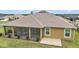 Exterior view of screened lanai and backyard at 892 Hubbard Loop, The Villages, FL 32163
