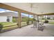 Spacious screened lanai with ceiling fans and view of the backyard at 892 Hubbard Loop, The Villages, FL 32163