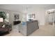 Inviting living room with tile floors, neutral walls, and comfortable seating arrangement with a ceiling fan at 892 Hubbard Loop, The Villages, FL 32163