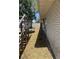 Side yard with lawn, fenced perimeter and a wooden deck at 916 Kentucky St, Haines City, FL 33844