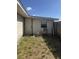 Small patch of yard with partial fencing and building exterior at 916 Kentucky St, Haines City, FL 33844