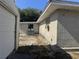 Side yard with partial grass and exterior view at 916 Kentucky St, Haines City, FL 33844