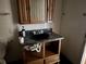 Modest bathroom featuring a dark sink, vanity, and medicine cabinet for storage at 916 Kentucky St, Haines City, FL 33844