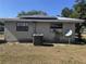 Exterior of home with solar panels on roof and a small yard at 916 Kentucky St, Haines City, FL 33844